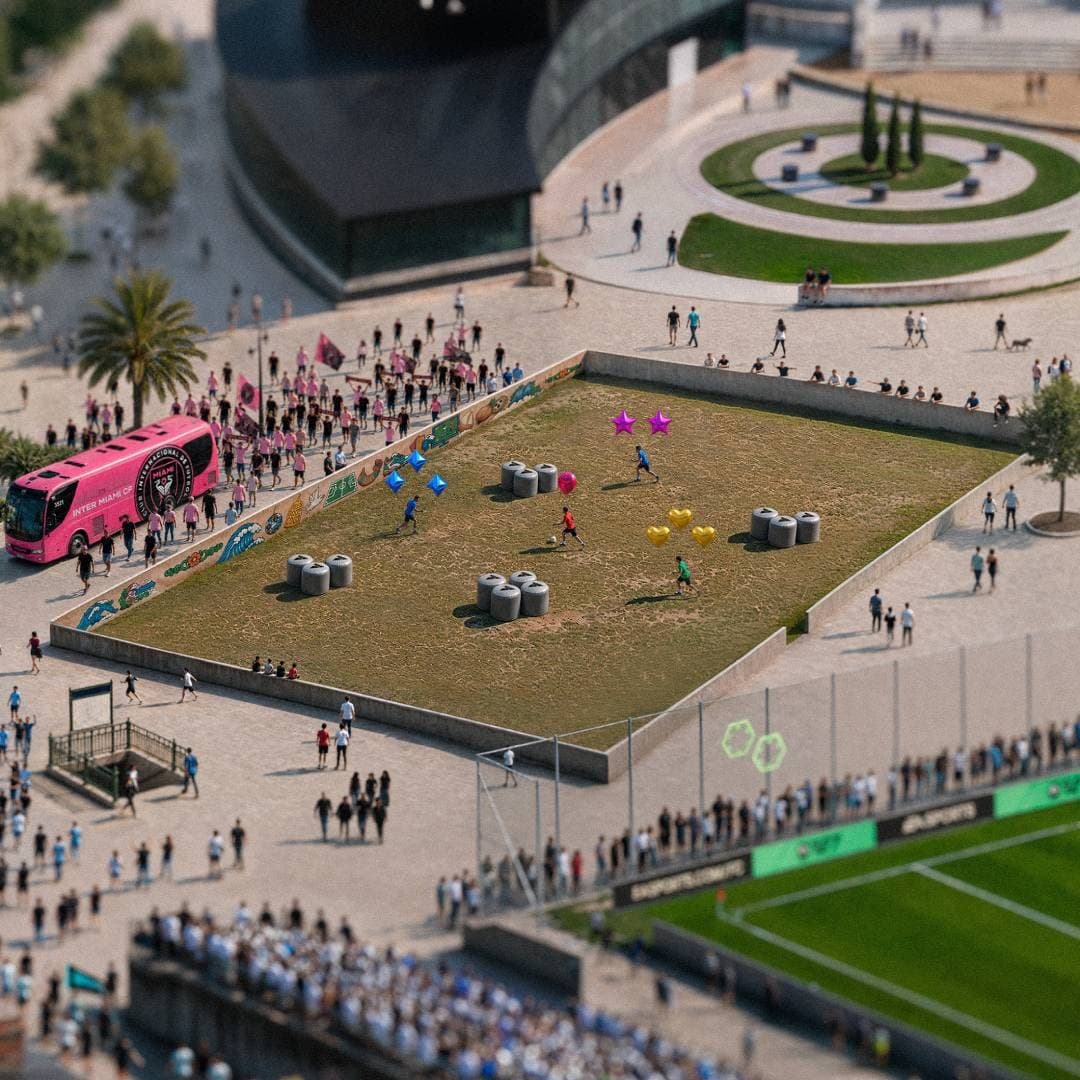 Players compete in a colorful balloon-themed football scene near a team bus.